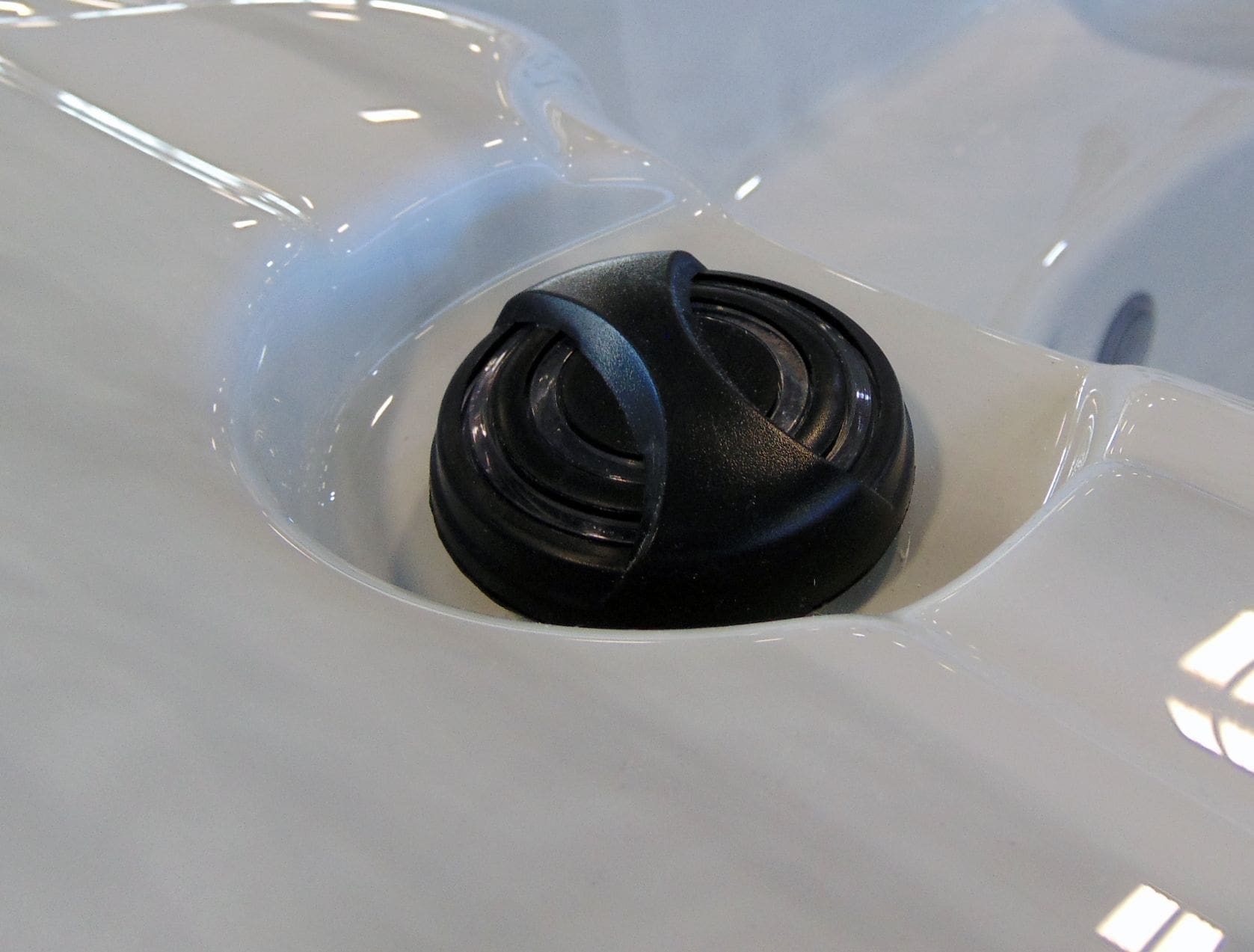 Close-up of the swim-current diverter valve molded into an Aquex swim spa shell