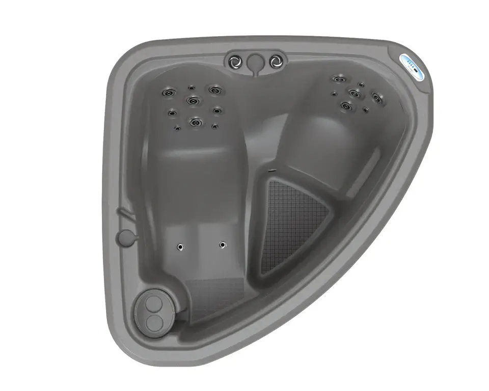 Overhead view of the DreamMaker Core 1800C corner hot tub showing two contoured seats and the footwell