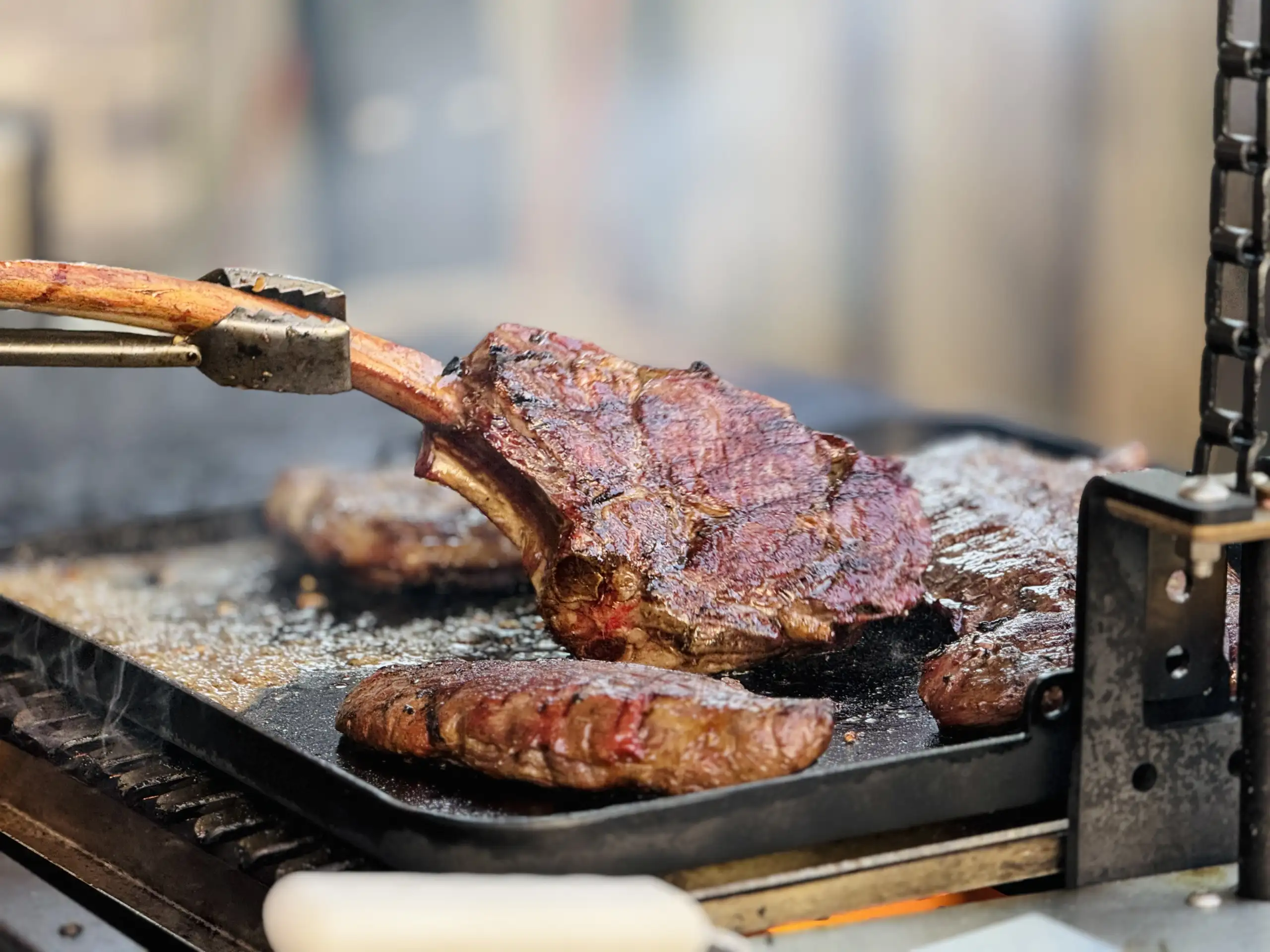 Yoder Smoker or Big Green Egg set up in a backyard cooking area