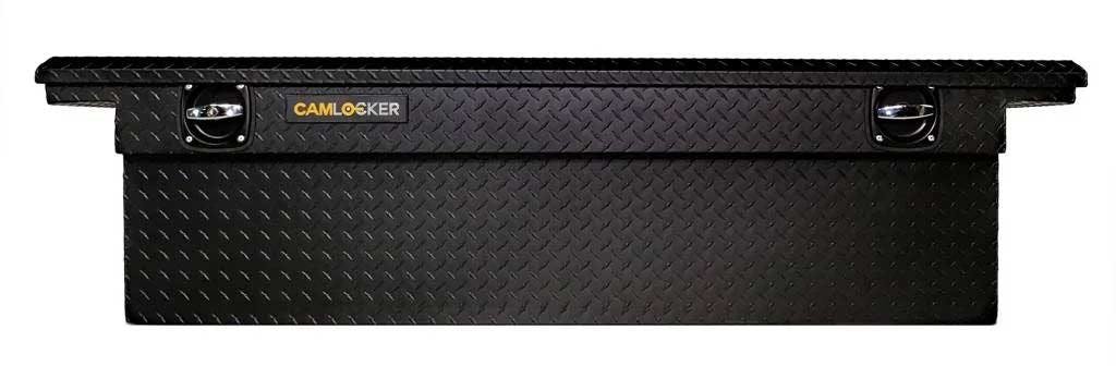 Black CamLocker crossover toolbox with diamond plate pattern and dual locking handles mounted on truck bed