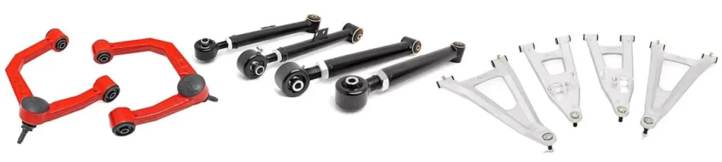 Red and black suspension control arms alongside black adjustable rods and white aluminum control arms arranged in rows