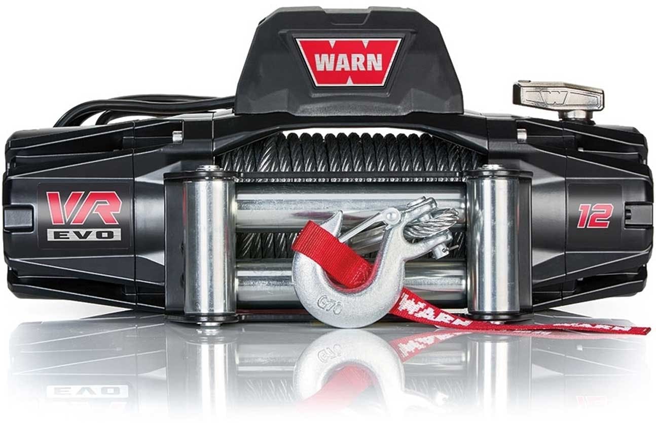 WARN VR EVO 12 electric winch with black housing, chrome drum, and red synthetic cable with hook attached to truck bumper
