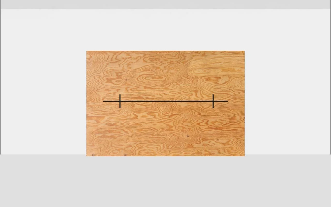 Horizontal line marked on plywood with vertical tick marks on left and right ends for headlight alignment testing
