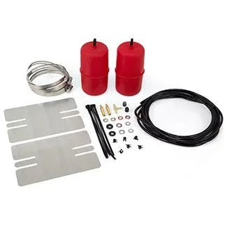 Air suspension kit with two red airbags, coiled hose, metal mounting brackets, black tubing, and assorted fasteners and