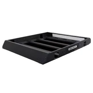 Black rectangular truck bed rack with metal mesh surface and side rails mounted on empty truck bed