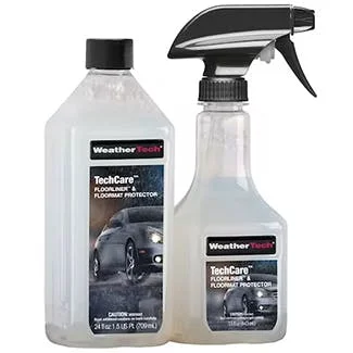 Two clear bottles of WeatherTech TechCare car cleaning products with spray trigger and pour spout dispensers.