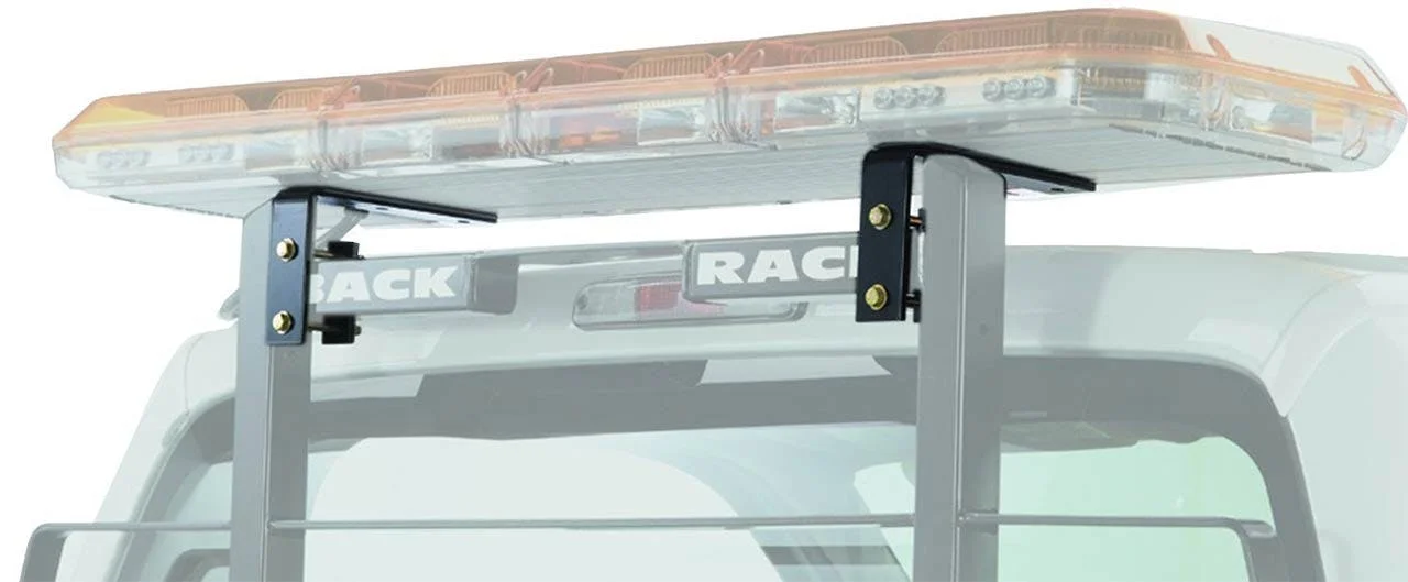 LED light bar mounted on top of silver truck rack with black support brackets visible