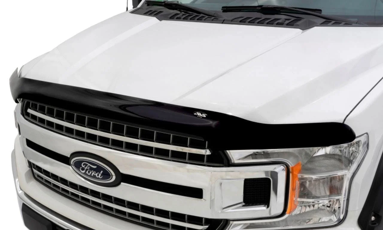 White Ford truck hood and grille with black mesh insert, front view against white background.