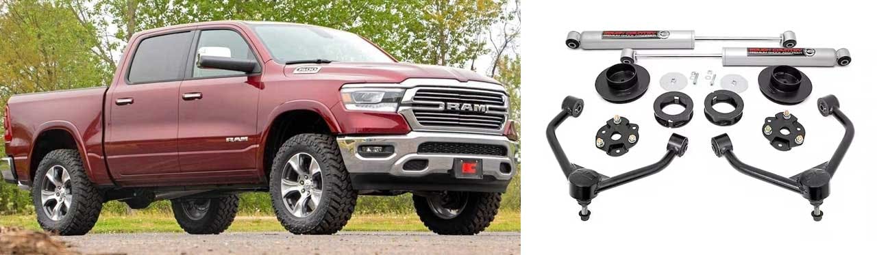 Lift kit components laid out separately including shocks, spacers, control arms, and hardware next to a lifted red Ram