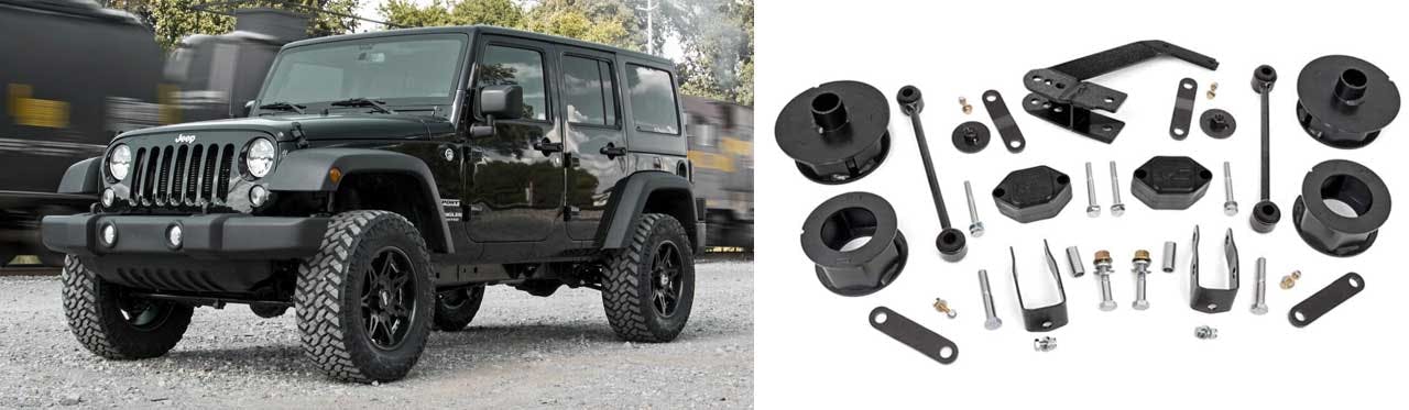 Black Jeep Wrangler parked beside disassembled lift kit components including spacers, brackets, bolts, and shock absorbers
