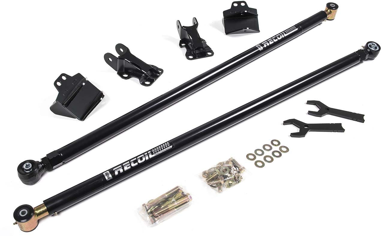 Black traction bars with mounting brackets, fasteners, and installation tools laid out on white background