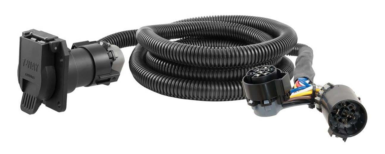 Black coiled electrical harness with 7-way trailer connector plug on one end and vehicle socket on the other
