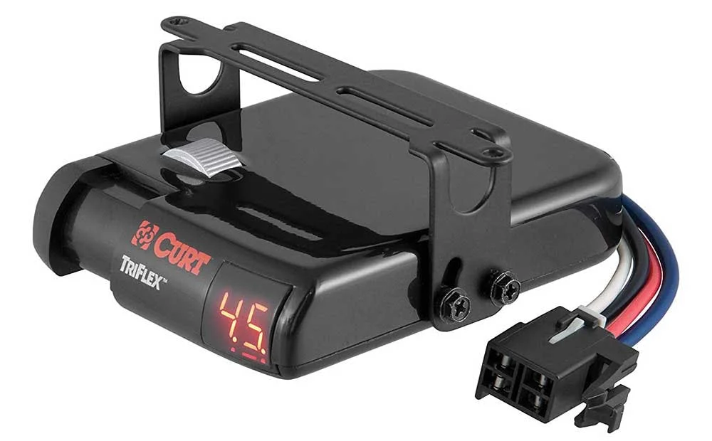 Black CURT Triflex brake controller with digital display mounted on bracket with wiring harness connector