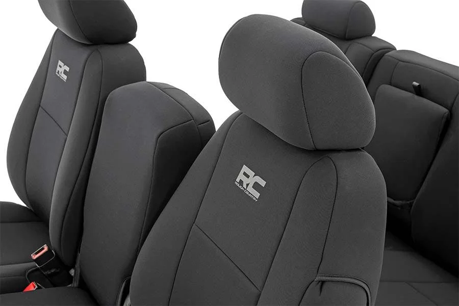 Black neoprene truck seat covers with embroidered logo on front passenger and driver seats with headrests