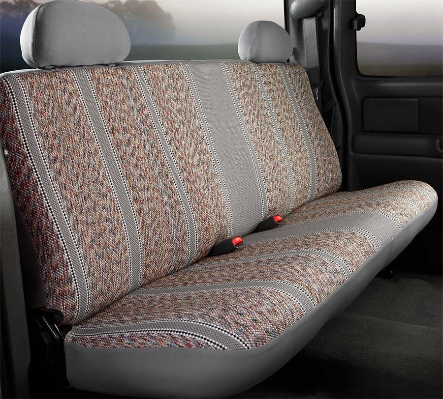 Brown and tan woven neosupreme seat cover with vertical striping installed on truck rear bench seat with gray headrests.