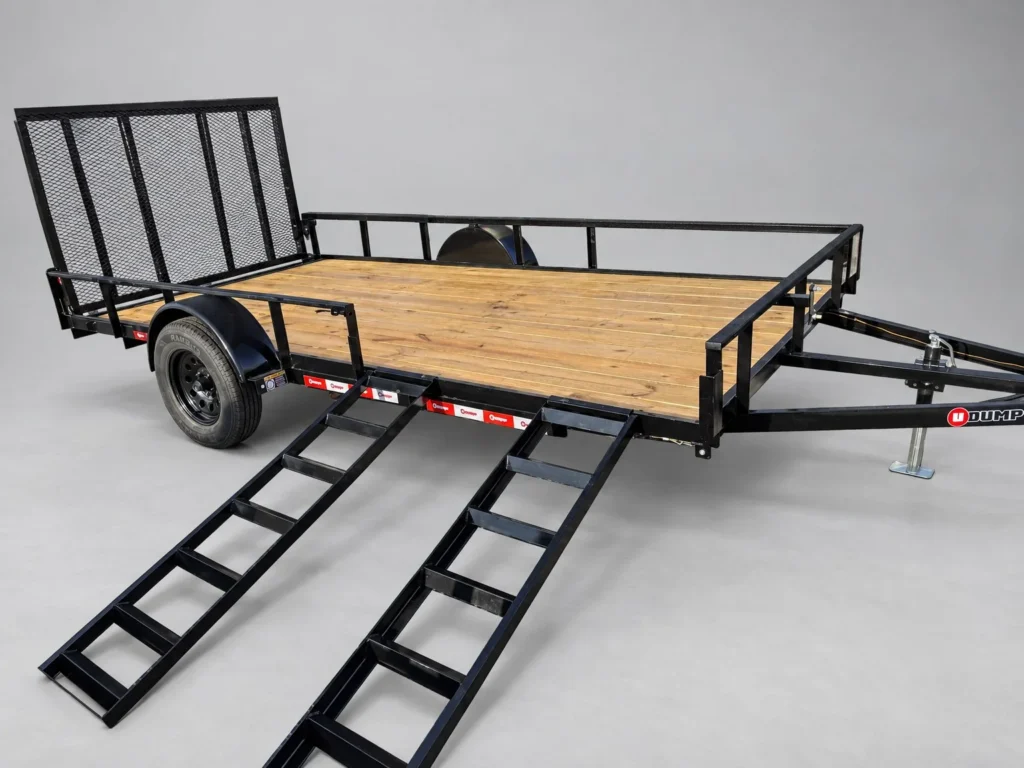 U-Dump 7x14 utility trailer with both front ramps set up on the side for loading