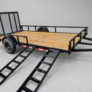 U-Dump 7x14 utility trailer with both front ramps set up on the side for loading
