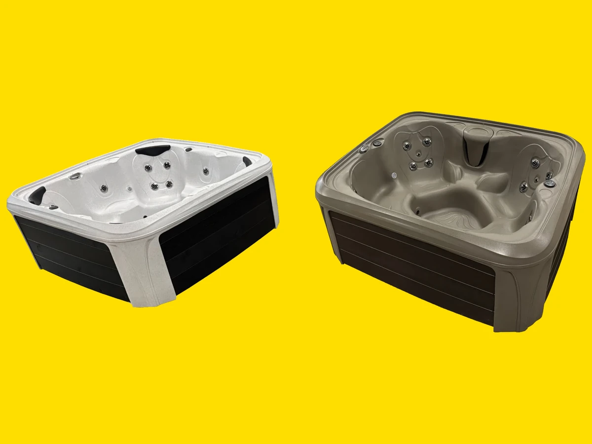 Two H&H hot tubs with moulded acrylic shells and dark slatted cabinets